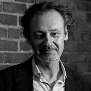 Portrait of Dana Willmer, Co-Founder of Partner Economics
